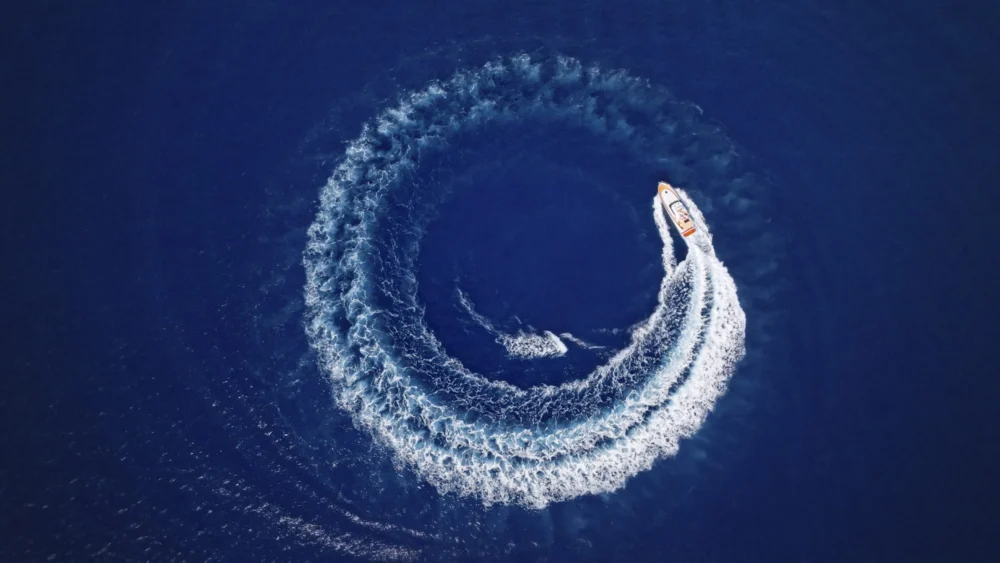 Yacht cruising fast in sea