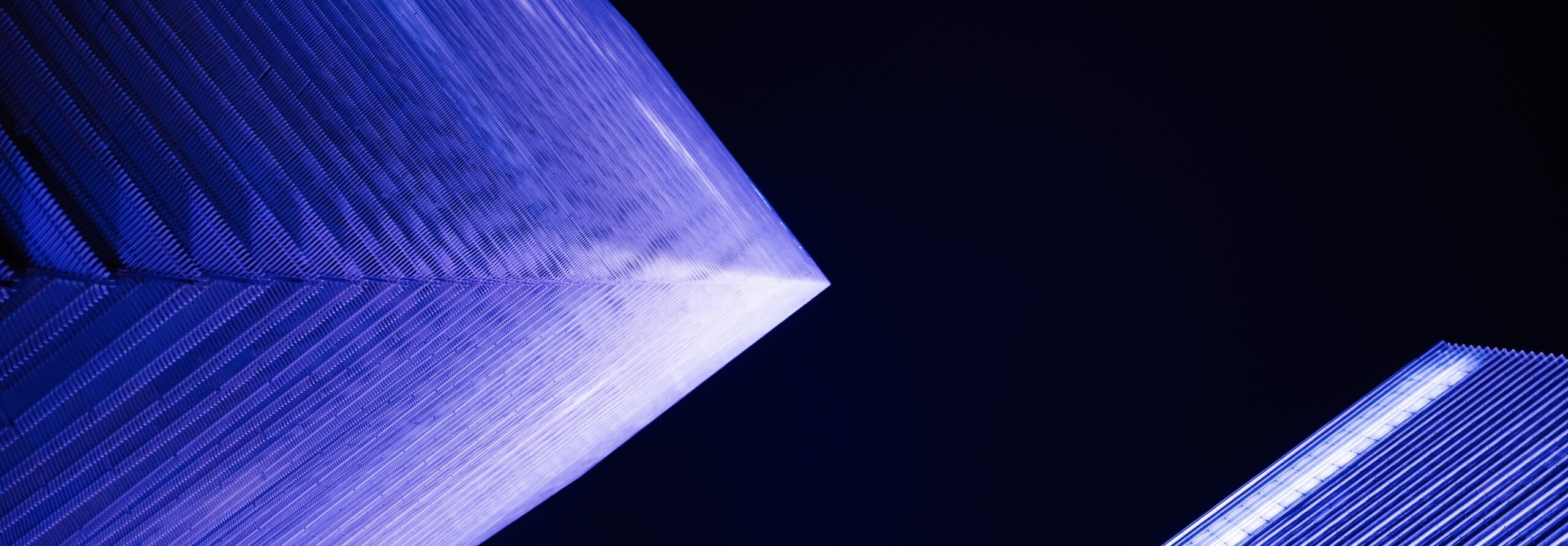 Low-angle view of modern financial buildings at night, Shanghai, China