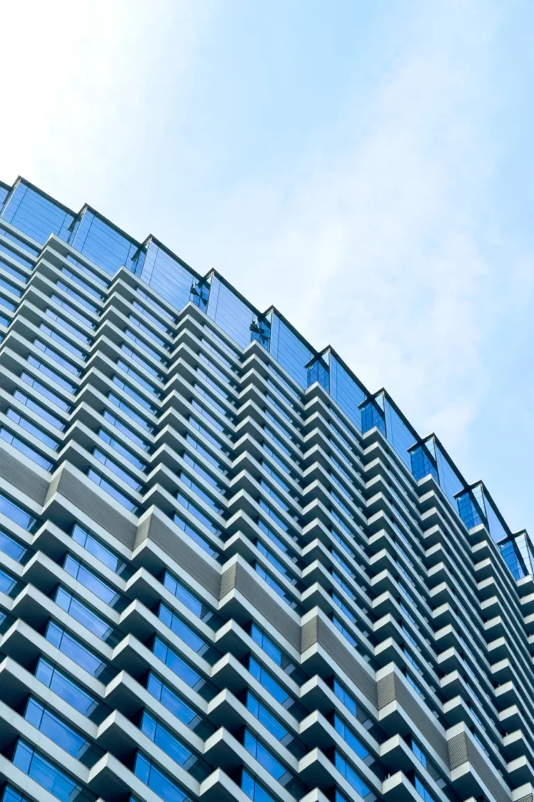 Looking up at the modern skyscrapers in city.