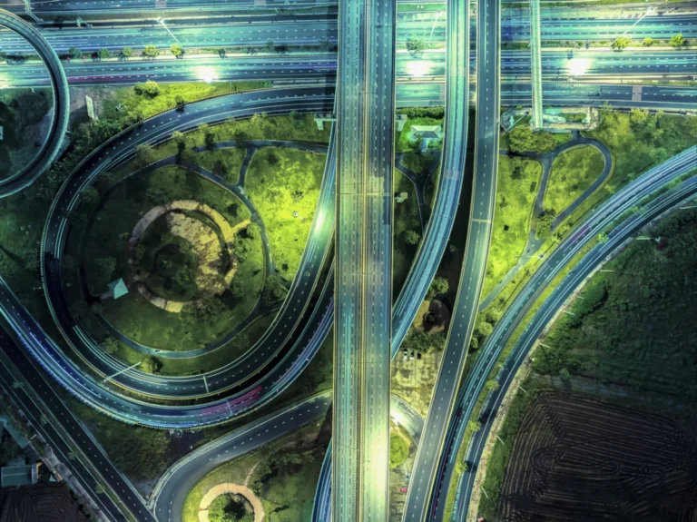 Aerial top view, Large circles highway for transportation road portation at night or futuristic concepts.