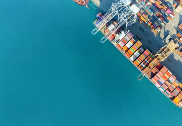 cargo ship and truck at seaport waiting for container dock crane