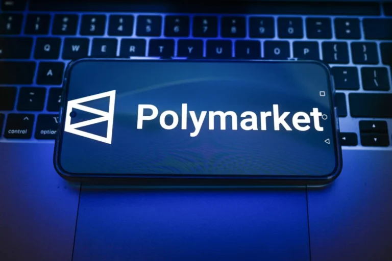 In this photo illustration, a Polymarket logo displayed on a
