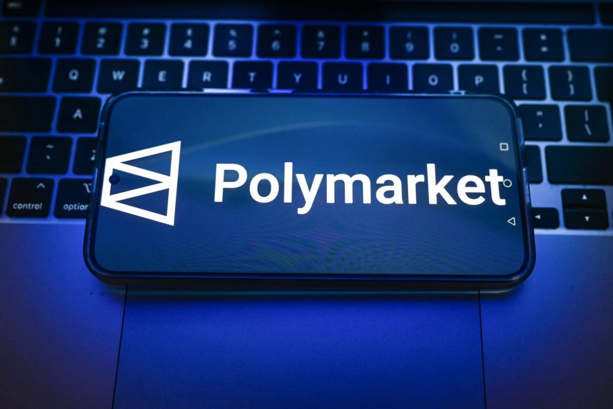 In this photo illustration, a Polymarket logo displayed on a